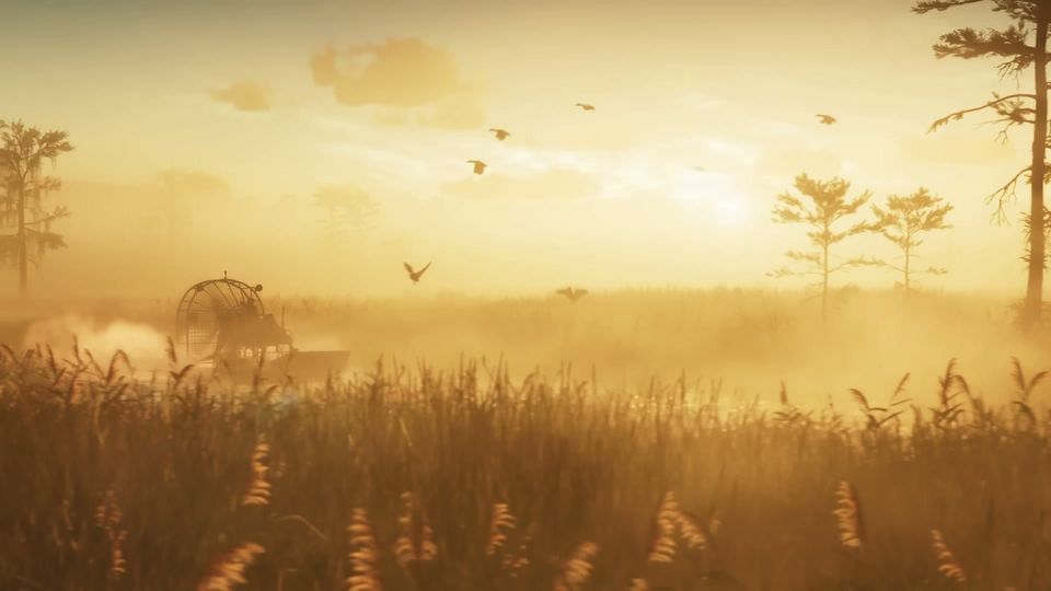 An airboat navigates through a misty, golden-lit swamp with tall grass and scattered trees, as several birds fly in the sky.