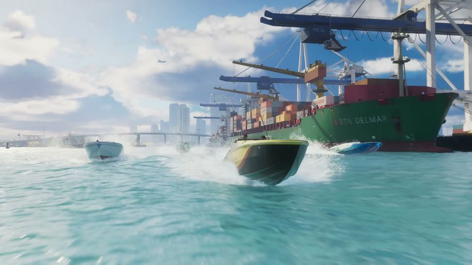 Three speedboats race across the water past a large cargo ship docked at a port, with a city skyline and bridge visible in the background.