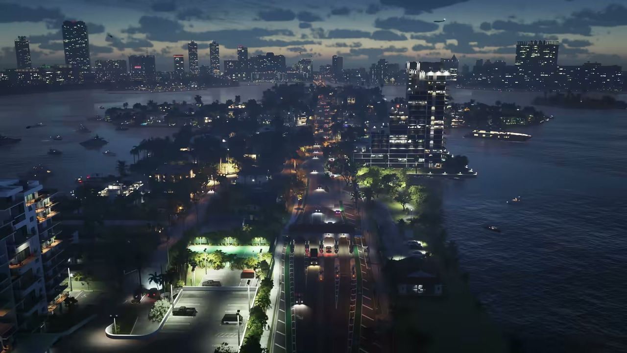 An aerial view at dusk shows a causeway with traffic, connecting islands with residential…