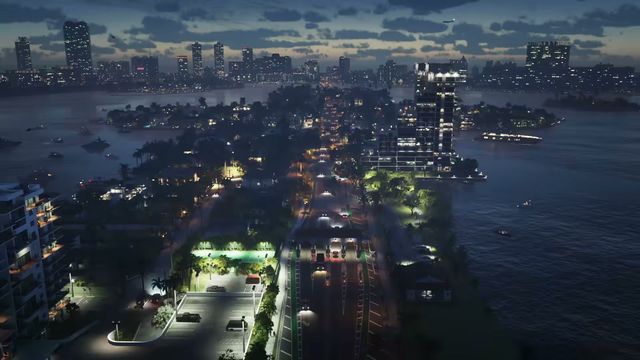 An aerial view at dusk shows a causeway with traffic, connecting islands with residential buildings and…
