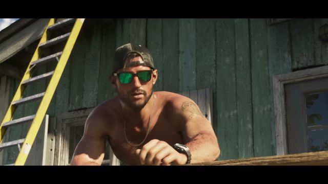 A shirtless Jason Duval, wearing a baseball cap and green mirrored sunglasses, leans on a wooden railing in…
