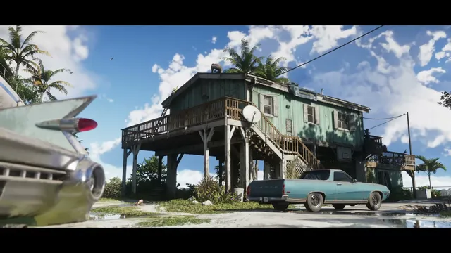 A weathered stilt house with a satellite dish and two classic cars parked outside under a blue sky with…