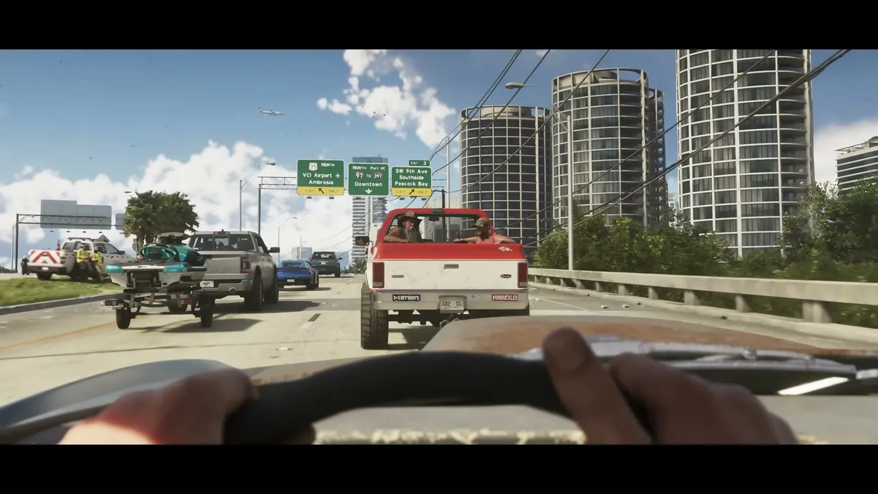 A first-person view from a car shows a multi-lane highway with traffic, including a red pickup…