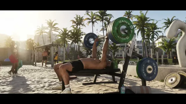 A man is bench-pressing weights at an outdoor beach gym, with palm trees and art-deco style buildings…